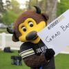 Chip holding a sign reading "Grad Bash"
