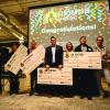 New Venture Challenge winners with prize checks