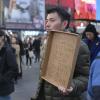 People gather for a rally in New York on March 16, 2023, to protest racism against Asian Americans