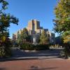 The historic Boulder County Courthouse, in its art deco style, stands in front of a bright blue sky, surrounded by a fountain, summer flowers and green-leafed trees. (Patrick Campbell/CU Boulder)
