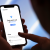 Finger touches a smartphone, with the screen reading: "Get more out of Gemini"