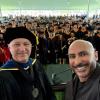 Department chair Karl Linden and alumnus Marco Campos with graduates in the background
