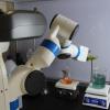 Robot mixing chemicals in a wet lab