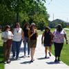 researchers and graduate students walking on campus