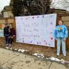 children who painted signs of community resilience and thanking first responders