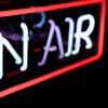 'on air' neon sign