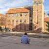 student sitting alone on campus