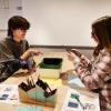 campus community members doing a craft at the art museum