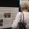 Attendee reads about Center for Research Data & Digital Scholarship projects at a showcase