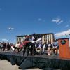 Ann Smead, left, and Brian Argrow, chair of the aerospace engineering department, cut a ribbon held by drones at a ceremony at the new Aerospace Engineering Sciences Building