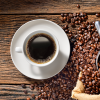 Cup of coffee and coffee beans