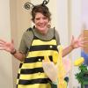 An instructor dressed in a bee costume