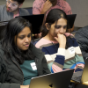 graduate students participating in a coding challenge