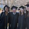 Graduates stand in Norlin Quad, celebrating their commencement