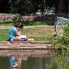 Student by lake.