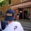 Man wearing black Fall Welcome Squad hat