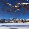 A view of the Flatirons from a quiet, snowy CU Boulder campus.