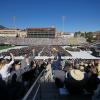 Commencement attendees celebrate in the stands of Folsom Stadium