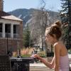 Savana Kokora works on laptop outside of the UMC