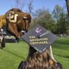 Student graduation cap reading 'The adventure continues'