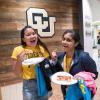 Students eating pizza during Connect at The Rec event in 2018