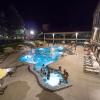 Students swimming in the Buff pool at night