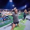 Students enjoy a yoga session pre-COVID on the rooftop tennis courts