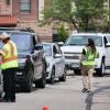 volunteers direct traffic on campus