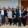 Members of the Boulder Faculty Assembly pose for a photo at an excellence awards ceremony.