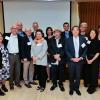 Members of the Boulder Faculty Assembly pose for a photo at an excellence awards ceremony.