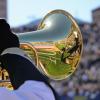 Gold Buff Marching Band member plays marching euphonium during Homecoming game