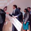 Stride Tech founders on stage at Boulder theater after winning the New Venture Challenge.