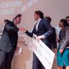 Stride Tech founders on stage at Boulder theater after winning the New Venture Challenge. (2019 file image)