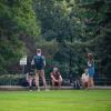 students outside in a group of six people