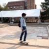 Student skateboarding on campus