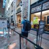 students wait in queue to enter the CU Book Store