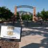 A Protect Our Herd–face covering required sign at the entrance of Farrand Field