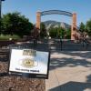 A Protect Our Herd–face covering required sign at the entrance of Farrand Field
