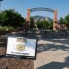 A Protect Our Herd–face covering required sign at the entrance of Farrand Field