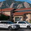 Two police vehicles are parked on the CU Boulder campus. (Patrick Campbell)