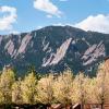 View of the Flatirons from CU Boulder campus in spring.