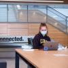 student wearing mask on campus