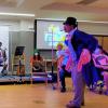 Client actors in a therapy group for aphasia perform in a theatrical production of Charlie and the Chocolate Factory
