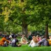 Students sit in a circle on Norlin Quad