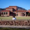 campus community member sitting outside