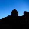 The shadowed tops of campus buildings with a bright blue sky above. (Photo by Patrick Campbell/University of Colorado)