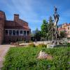 A sculpture and a flower bed outside the UMC