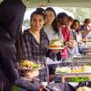 Students make plates of food in a buffet line during CUnity Fest
