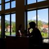 Silhouette of a student studying on campus