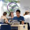 Students working on laptops on campus